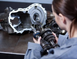 female-mechanic-holding-spare-parts_1170-1421